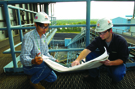 Engineers reviewing schematics